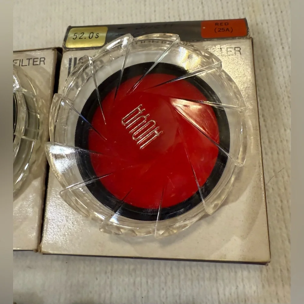 Lot of 4 Hoya photographic filters and 4 filter cases.
